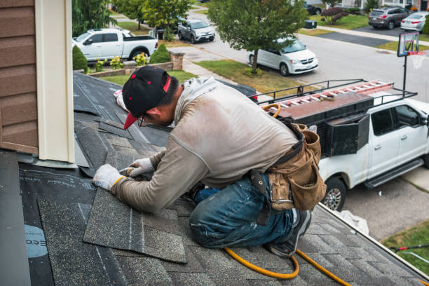 Professional Roofing technician working in East Nassau, NY